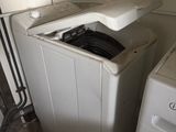 a washer and a dryer in a small room