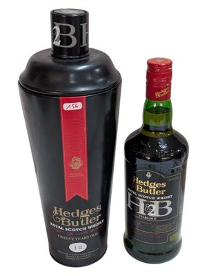 two bottles of alcohol are sitting next to each other on a white surface