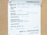 a piece of paper taped to a bulletin board with writing on it