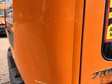 a close up of the back end of an orange truck