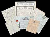 an image of a pile of old papers with a red wax stamp on them