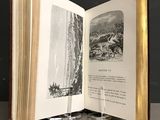 an open book with a picture of a man riding a horse