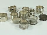 many different types of silverware on a white surface