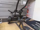a black exercise bike on a wooden floor in a room