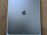 an apple ipad is sitting on top of a wooden table
