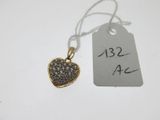 a close up of a heart shaped pendant with a price tag on it
