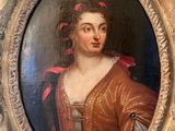 painting of a woman in a red dress in a gold oval frame