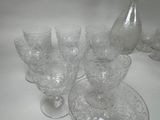 a lot of glasses and a pitcher on the table