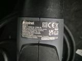 a close up of a cell phone that is connected to a charger