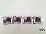 four mugs with a picture of a cat on them sitting on a table