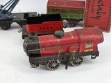 a toy train that is sitting next to other toy trains