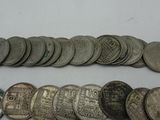 a close up of a bunch of coins sitting on top of a table