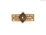 a close up of a gold ring with pearls on it