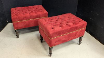 pair of red velvet foot stools on casteors with gold trim