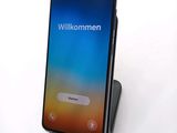 an image of a cell phone sitting on top of a stand