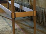 an image of a bed with a wooden frame in a room