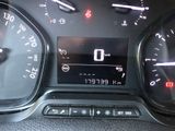 a close up of a car dashboard with a clock on it