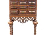 an old wooden cabinet with many drawers on top of it