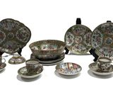 many different types of dishes and cups on the table