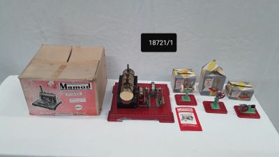 a table with a box of items and a sewing machine on it