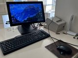 a computer on a desk with a keyboard and mouse