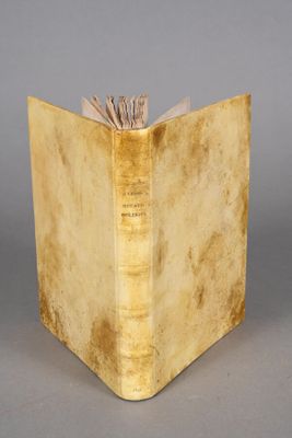 an old book with a bookmark sticking out of it ' s cover