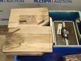 a blue box with a wooden box inside of it