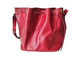 red leather bucket bag on white background with clipping for text