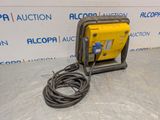 a yellow and black air compressor sitting on top of a floor