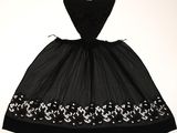a black and white dress with white flowers on it