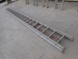 a ladder that is laying on the ground next to some chairs