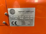 a close up of a label on the side of an orange machine