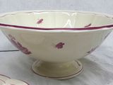 a bowl and plate on a table with a white background