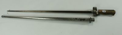 pair of old metal nails on a white surface with a white background
