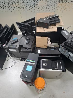 a pile of electronic equipment that is sitting on the floor