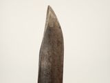 a large knife that is sitting on top of a table