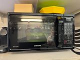 a microwave that is sitting on top of a counter