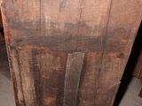a wooden cabinet that has a door on it