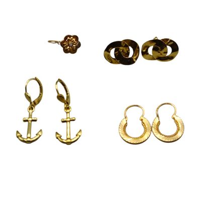 three pairs of earrings and a ring are shown on a white background