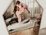a mirror that has a picture of a woman and a baby in it