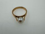 an image of a gold ring with a pearl on it