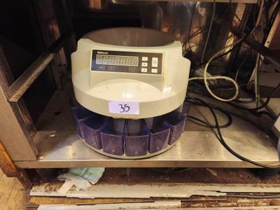 a machine that is sitting on a shelf in a room