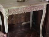 a small table with a lamp on top of it