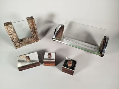 four different pieces of wood and glass on the table