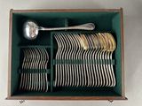 many spoons and spoons in a green box