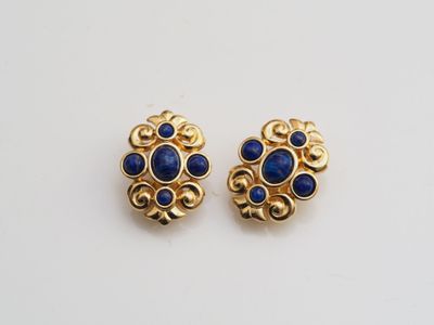 a pair of gold and lapis earrings