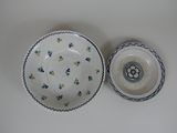 a small bowl and a small bowl sitting on a table