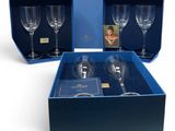 two empty wine glasses in a blue box with a picture of a woman