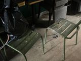 a green chair and a table in a room