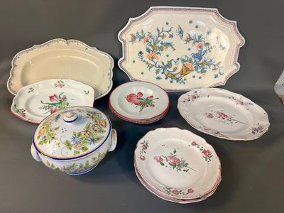 many different types of plates and bowls on the table